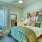 a bedroom with a bed and a chair