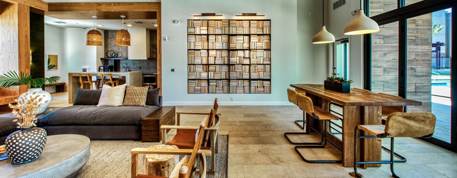 a living room with a bar and chairs