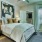a bedroom with a bed and a chair